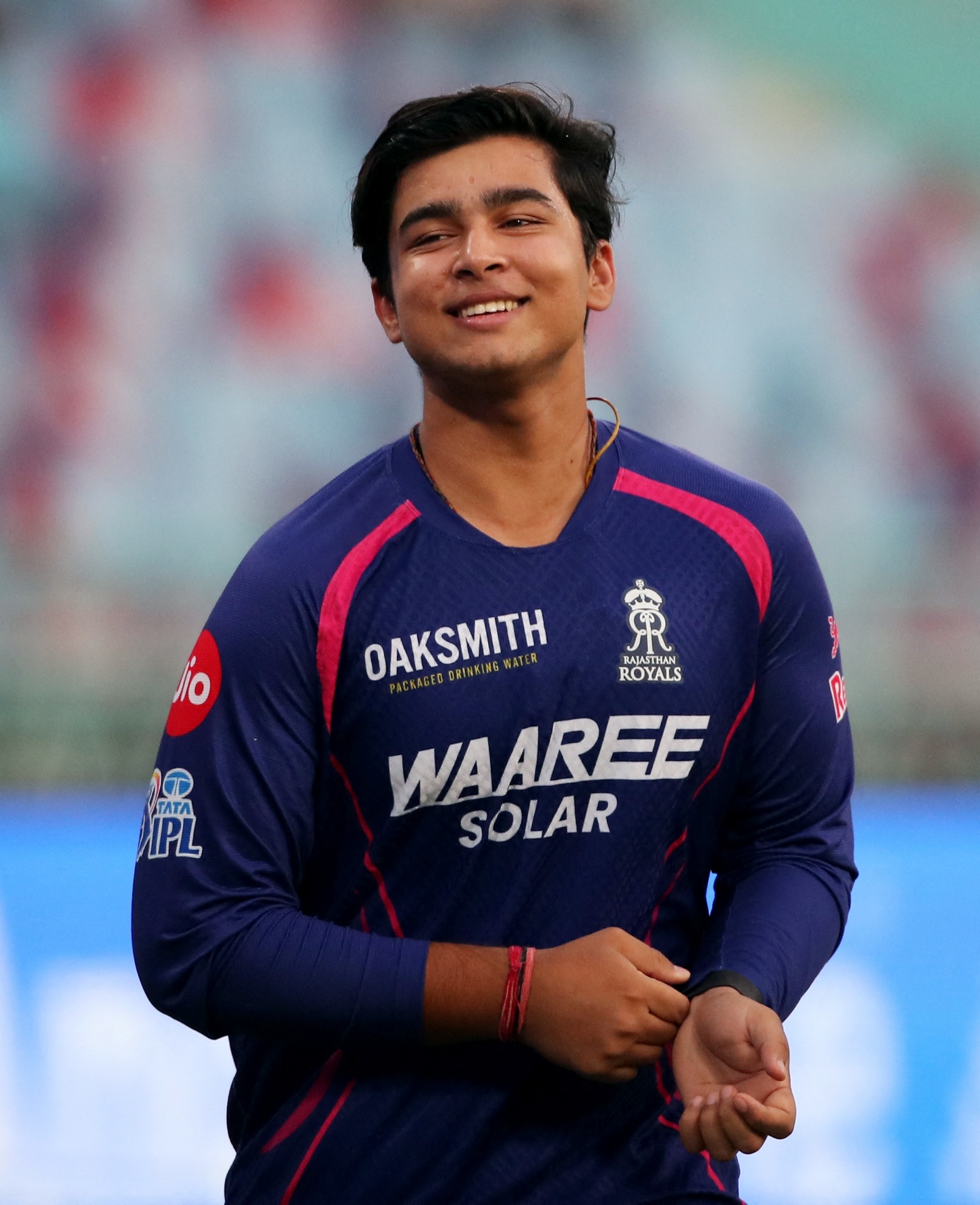 Vaibhav Sooryavanshi smiling in Rajasthan Royals kit